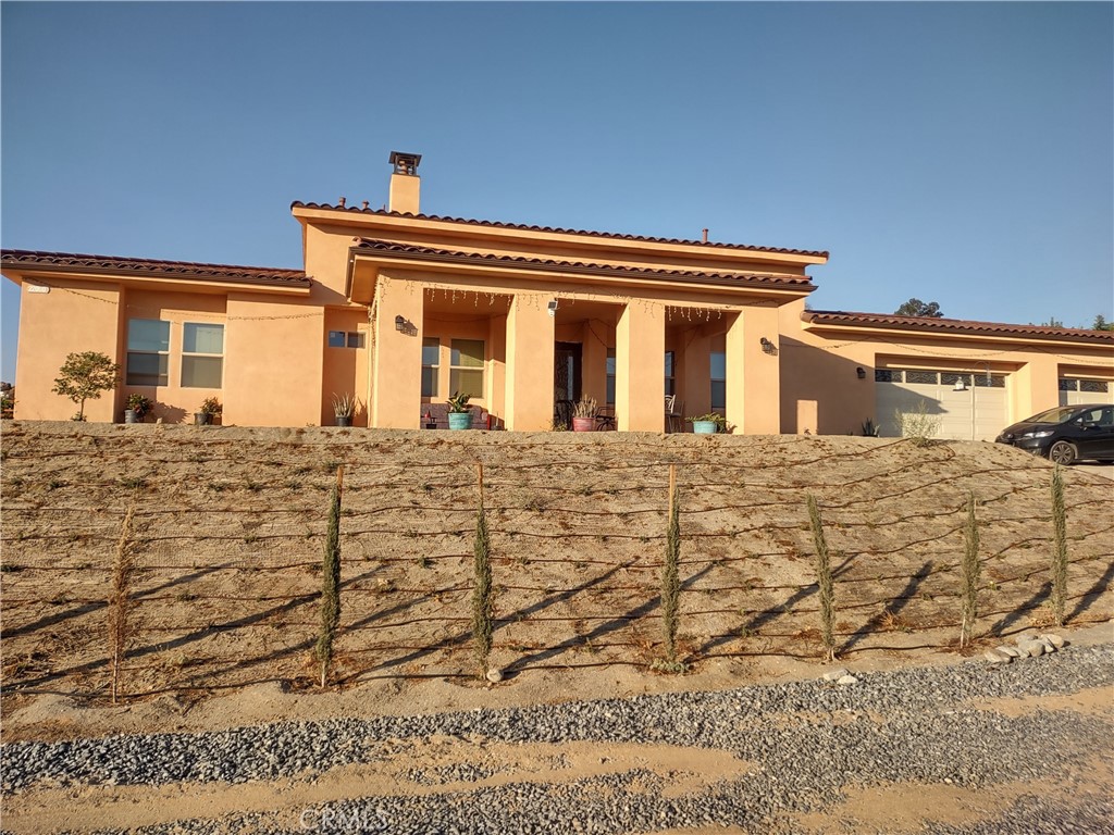 A property available for sale at 22060 Caballeros Canyon, Nuevo, CA 92567.