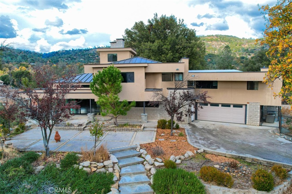 A property available for sale at 49868 49876 River Falls Way, Oakhurst, CA 93644.