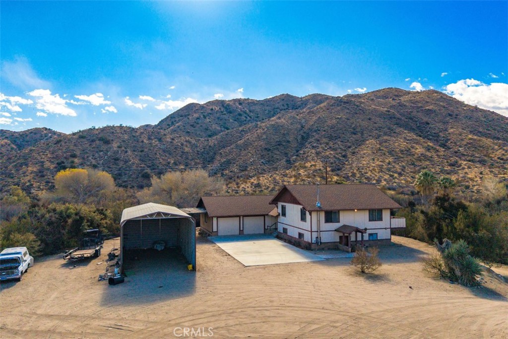 A property available for sale at 52324 Canyon Road, Morongo Valley, CA 92256.