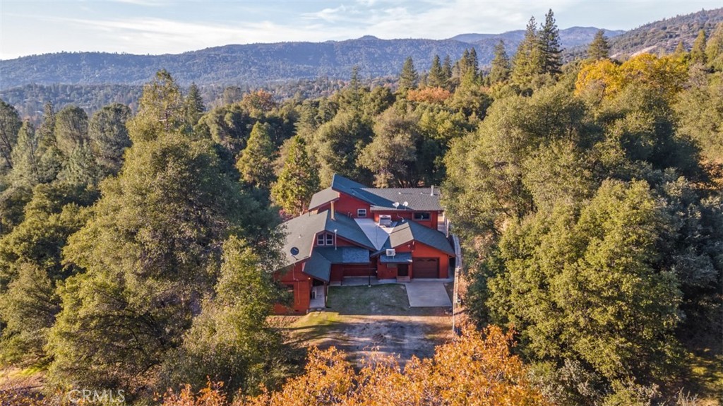 A property available for sale at 42203 Oak Lane, Oakhurst, CA 93644.