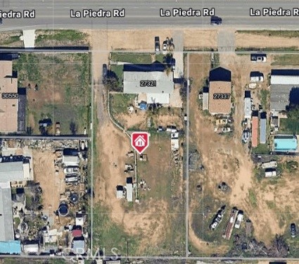 A property available for sale at 27321 La Piedra Road, Menifee, CA 92584.