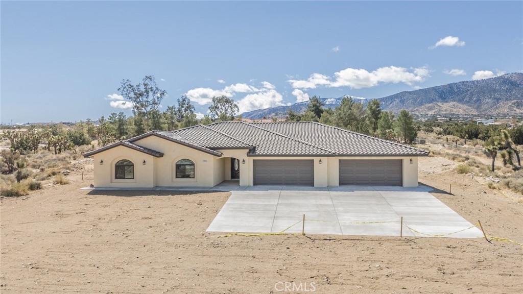 A property available for sale at 1483 Smoke Tree Road, Pinon Hills, CA 92372.