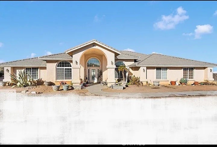 A property available for sale at 9098 Rattlesnake Road, Phelan, CA 92371.