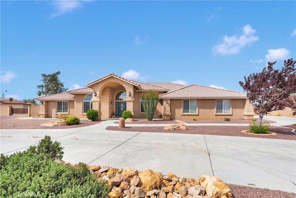 A property available for sale at 19501 Kinai Road, Apple Valley, CA 92307.