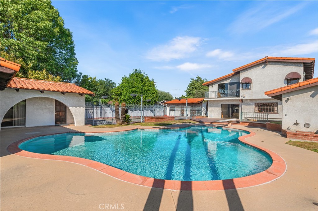 A property available for sale at 9221 Rives Avenue, Downey, CA 90240.