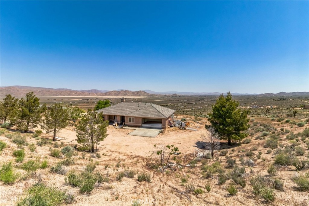 A property available for sale at 8975 Pumalo Road, Lucerne Valley, CA 92356.