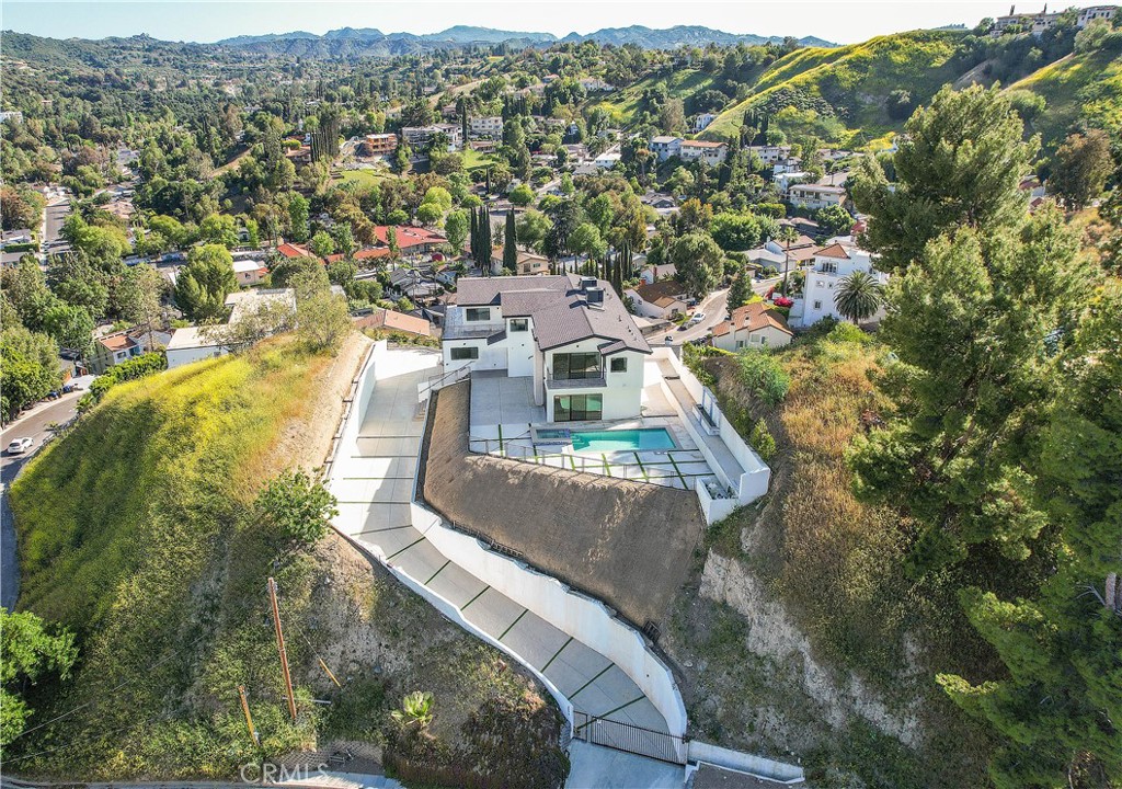 A property available for sale at 5099 Llano Drive, Woodland Hills, CA 91364.