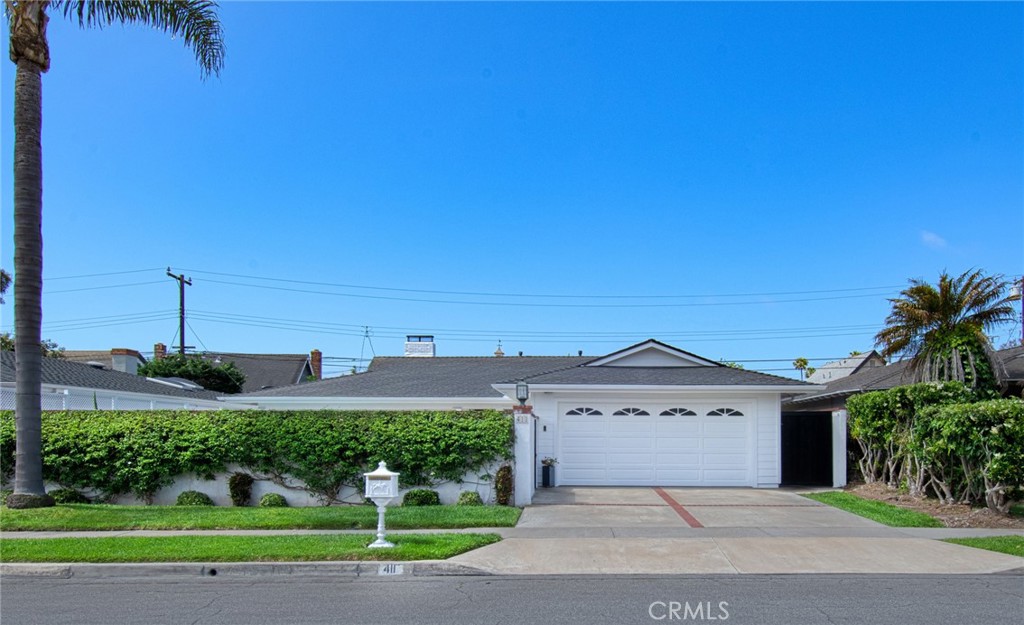 A property available for sale at 411 Lenwood Drive, Costa Mesa, CA 92627.