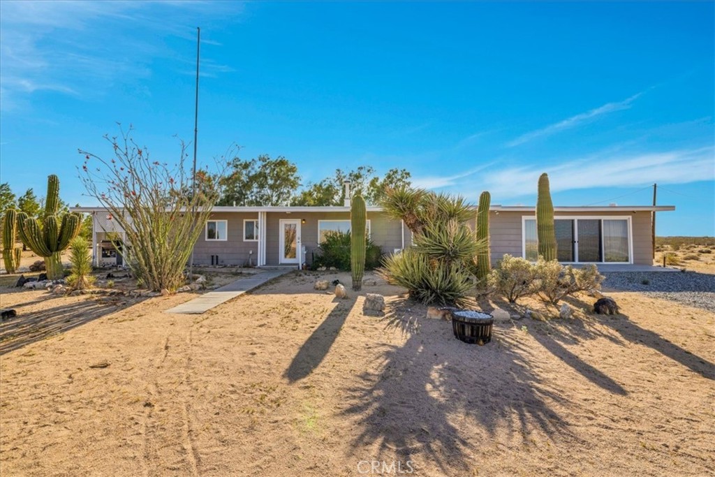 A property available for sale at 4171 Hughes Lane, Landers, CA 92285.