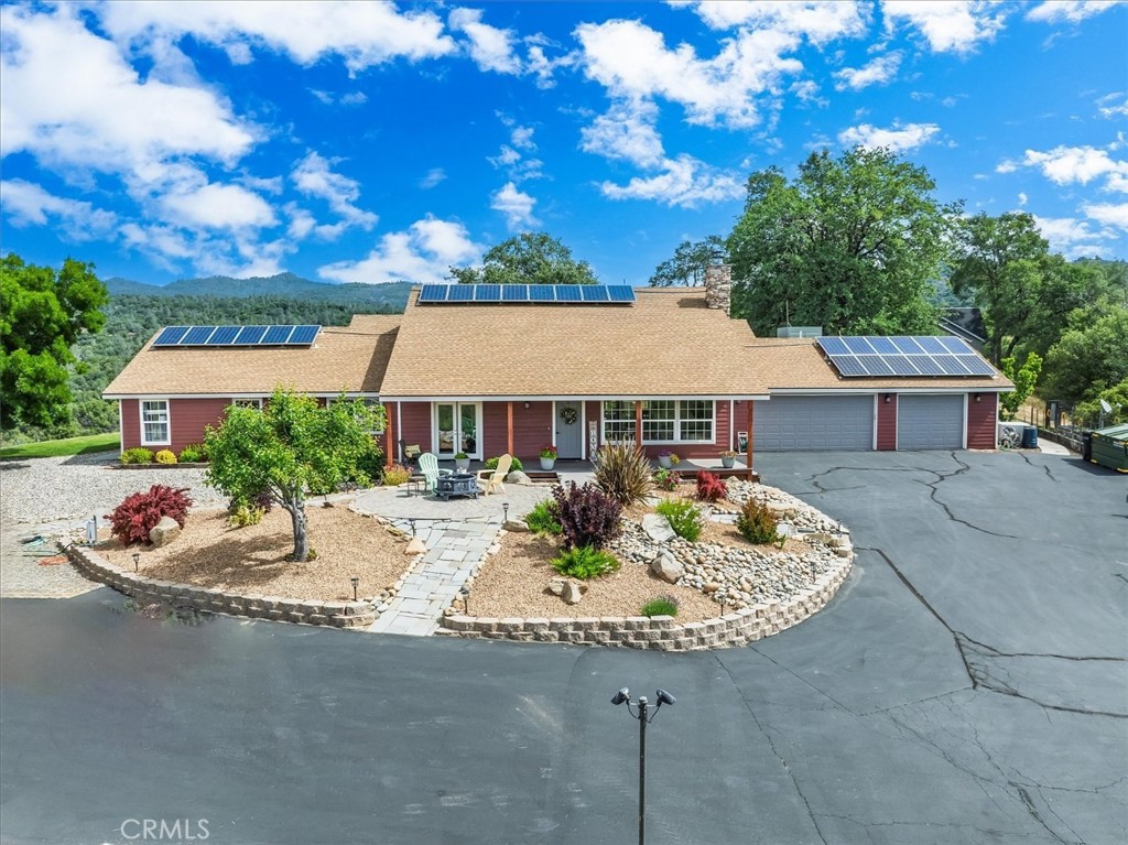 A property available for sale at 47527 Miami Highlands Drive, Oakhurst, CA 93644.
