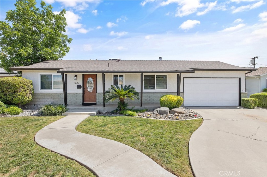 A property available for sale at 1505 Cypress Lane, Lemoore, CA 93245.