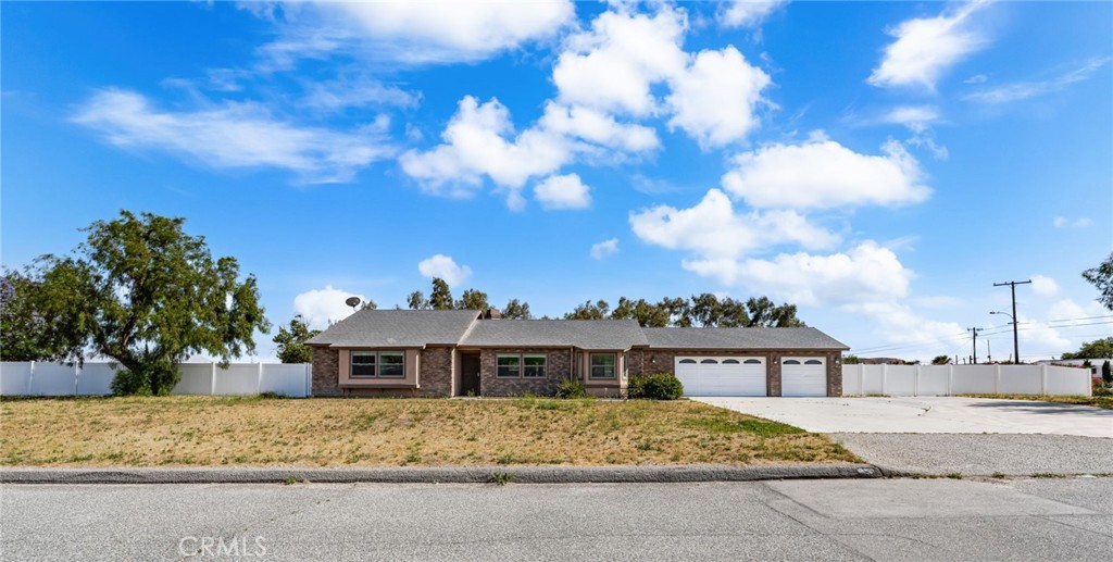 A property available for sale at 19115 Ash Street, Bloomington, CA 92316.