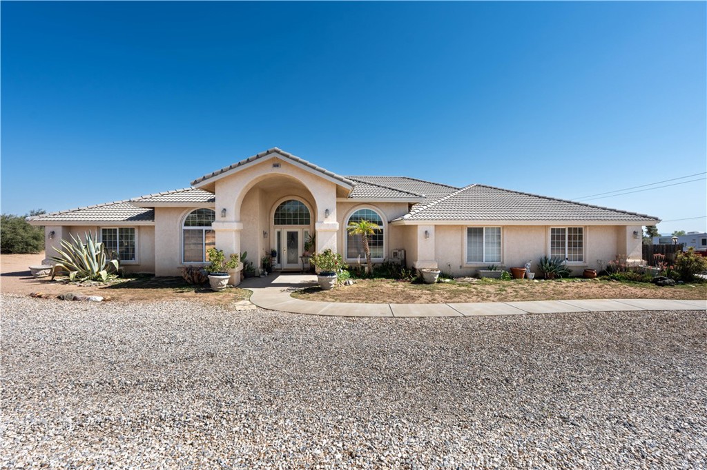 A property available for sale at 9098 Rattlesnake Road, Phelan, CA 92371.