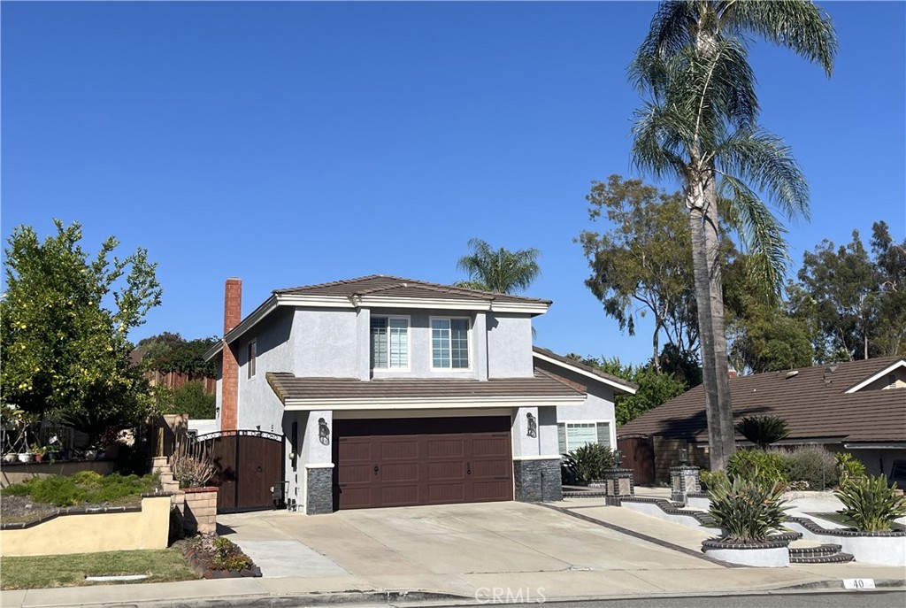 A property available for sale at 40 Country Wood Drive, Phillips Ranch, CA 91766.