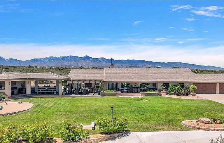 A property available for sale at 8686 Capelin Road, Phelan, CA 92371.