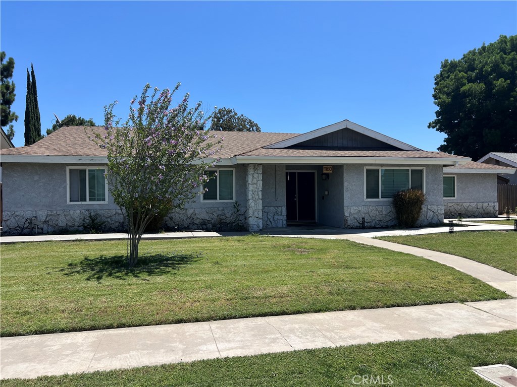 A property available for sale at 1160 N Laspina Street, Tulare, CA 93274.