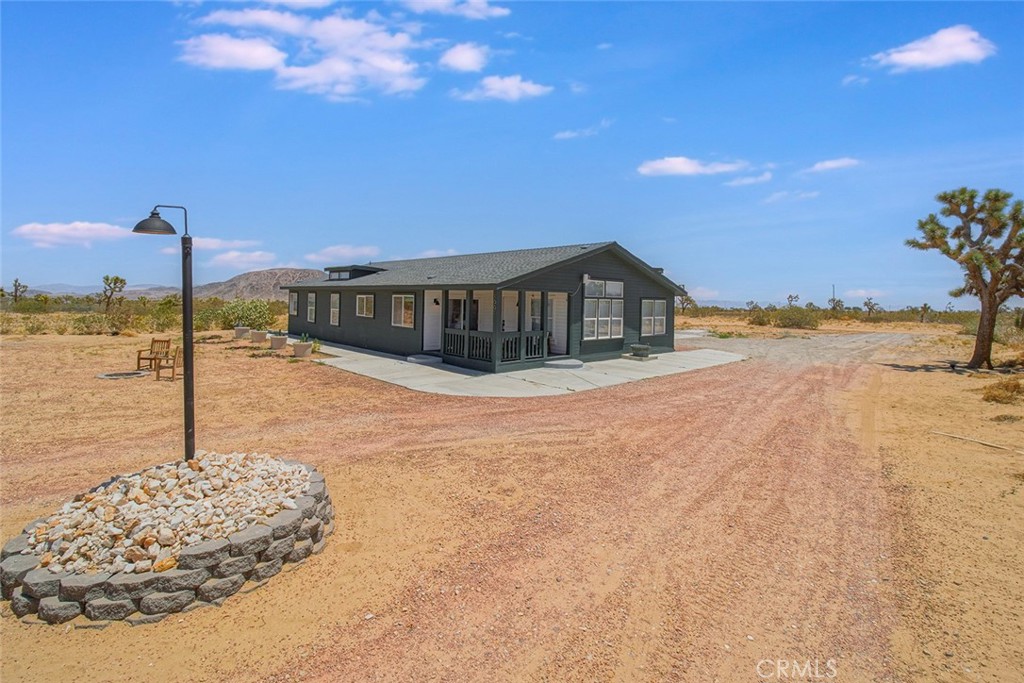 A property available for sale at 1001 Gibralter Road, Landers, CA 92285.
