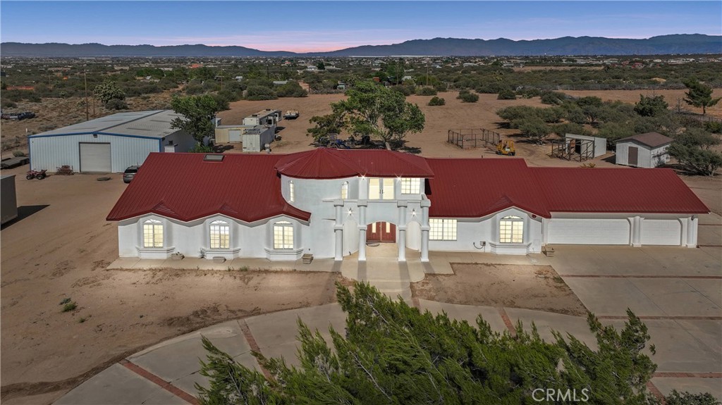 A property available for sale at 8381 White Road, Phelan, CA 92371.