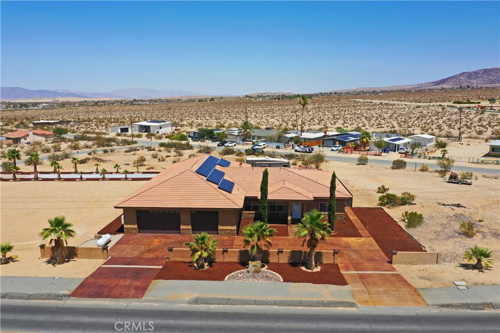 A property available for sale at 7225 Adobe Road, 29 Palms, CA 92277.