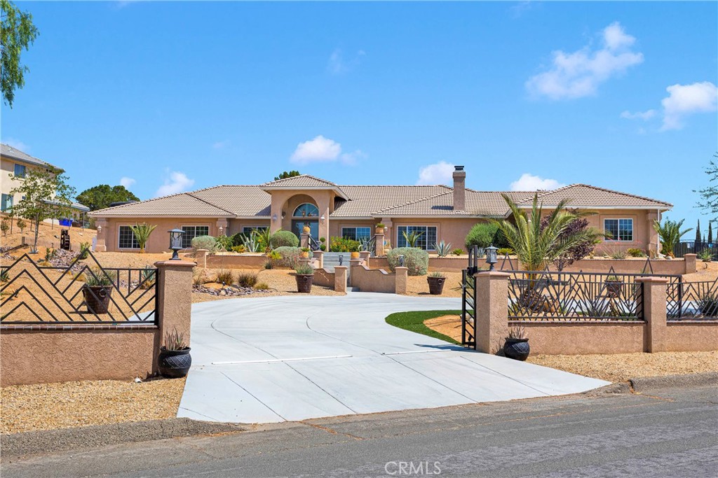 A property available for sale at 19420 Red Feather Road, Apple Valley, CA 92307.